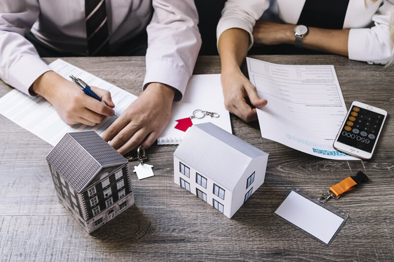 Advisers discussing a mortgage around a table